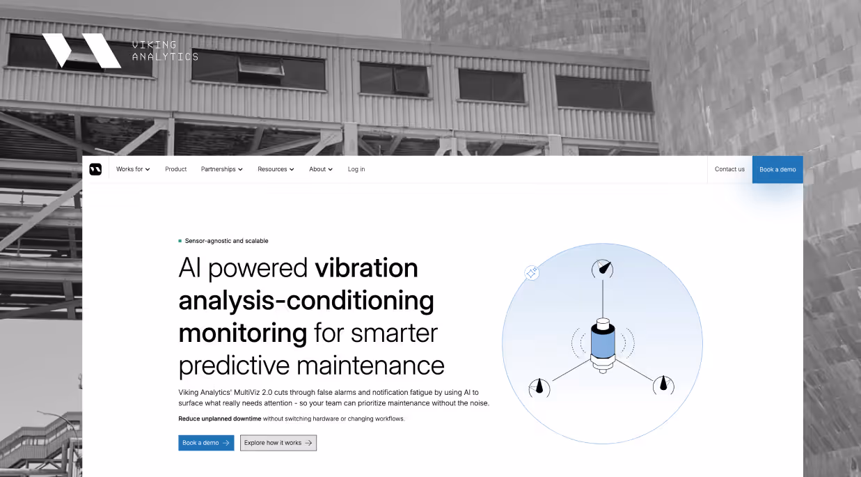 The Viking Analytics website over a photograph of an industrial building